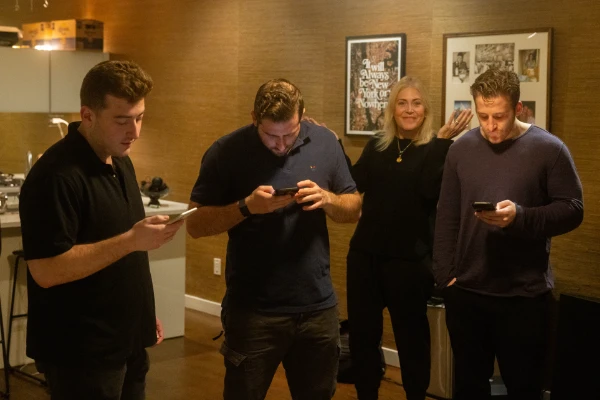 Tammy Cohen and her sons with phones